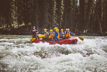 Group on a raft from Mukwah Rafting going down Panther River.