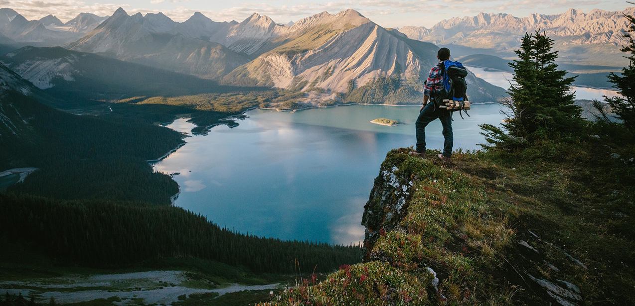 Hiker at Rawson Lake viewing Sarrail Ridge