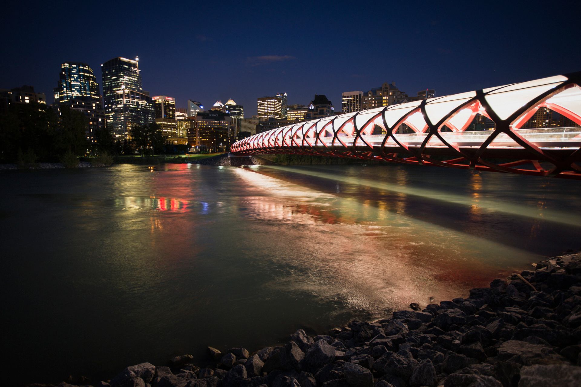 Peace bridge at night with a view of Calgary downtown