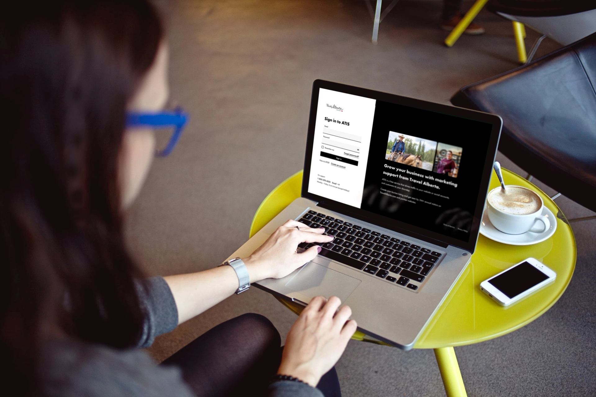 Person using a laptop to navigate to the new ATIS Web App