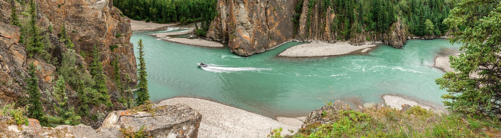 A jet boat powers through the waters of Sulphur Gates in Grande Cache