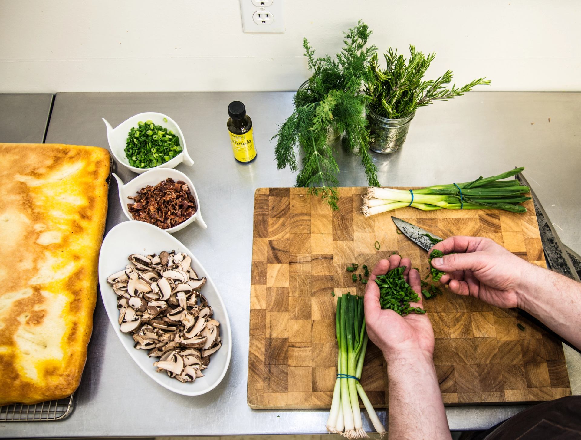 Close-up of food preparation inside the Kitchen by Brad Smoliak in Edmonton.