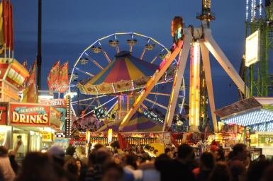 Crowd of people walking in the midway at night during K-Days in Edmonton.