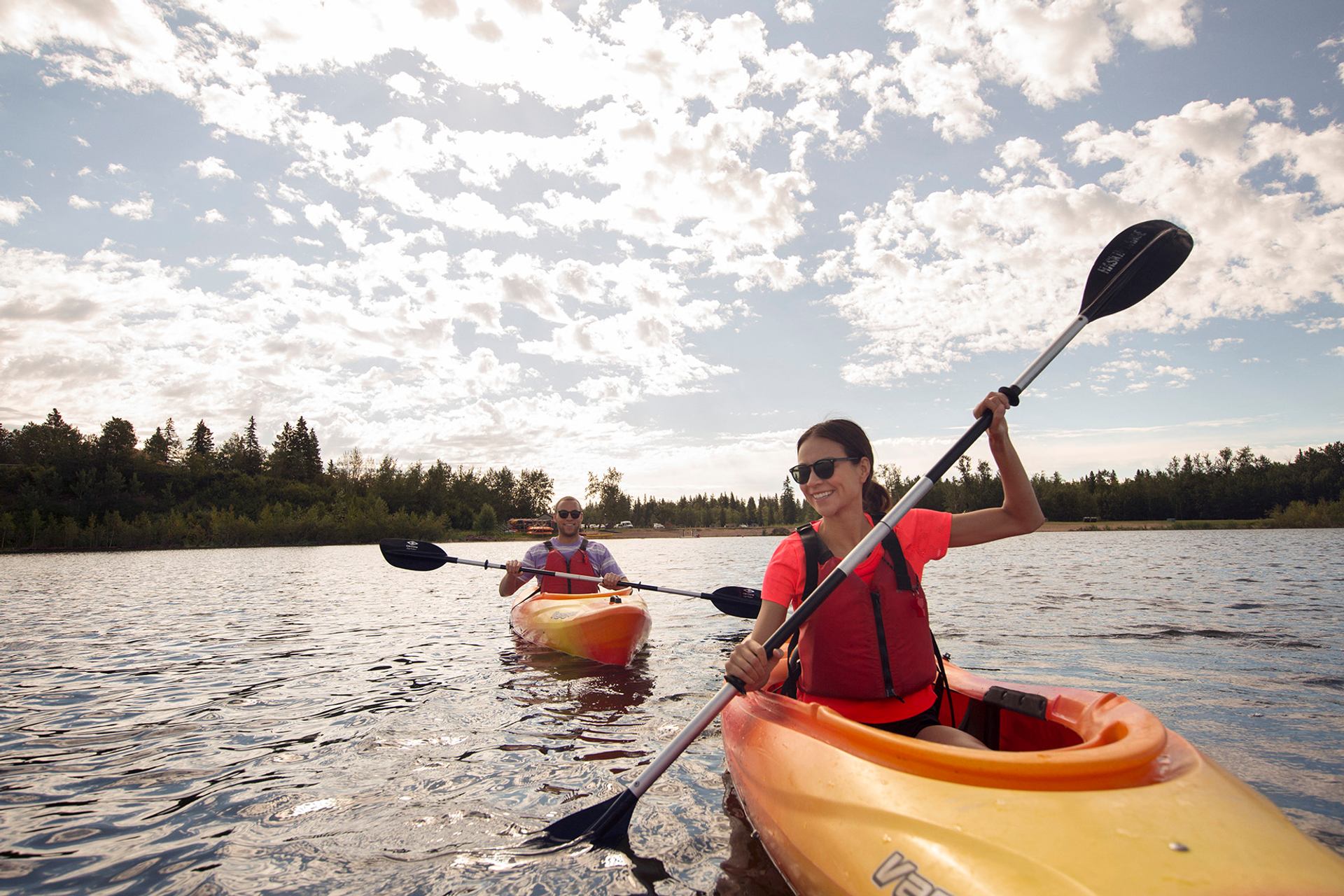 Couple kayaking on Astotin Lake in Elk Island National Park.