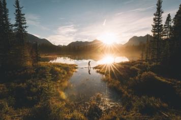 Sunset at Goat Pond with someone walking across