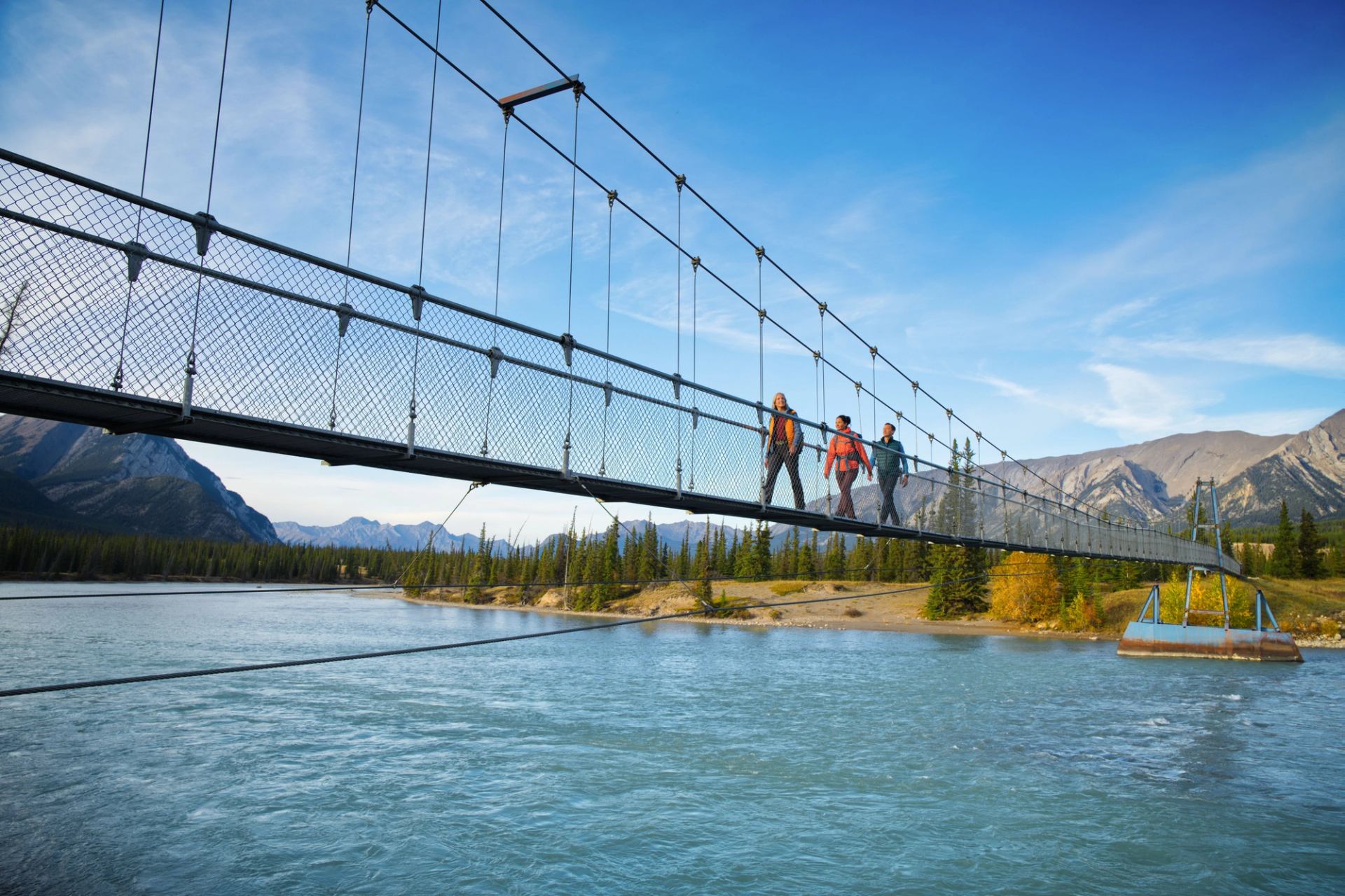 People crossing a bridge in Nordegg, Alberta