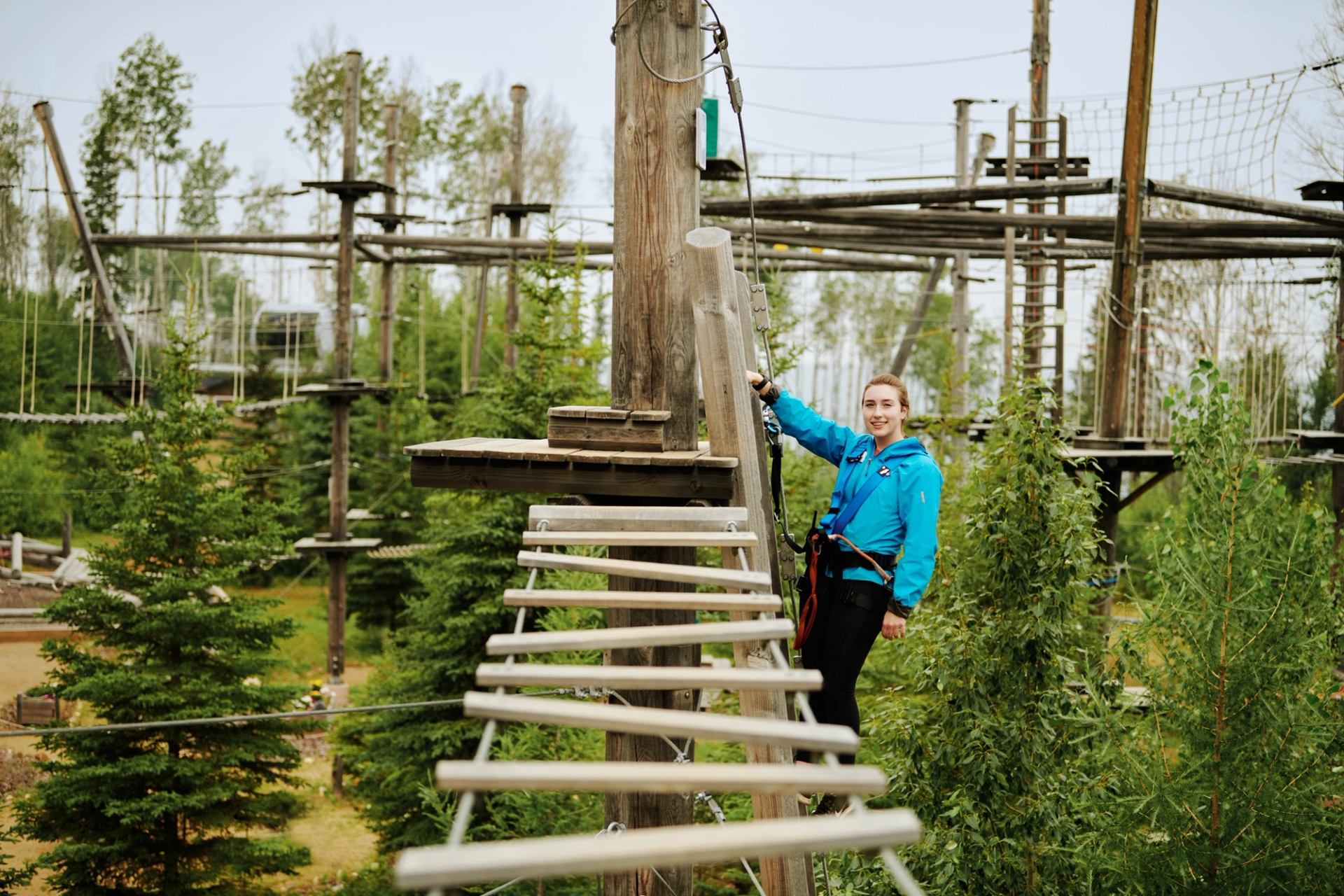 woman climbing forest