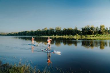 Two people paddleboarding near Fort McMurray.