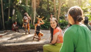 Girl enjoying an Indigenous experience at Currumbin Wildlife Sanctuary on the Gold Coast