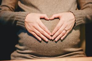 Five hearts are beating in this woman's womb...