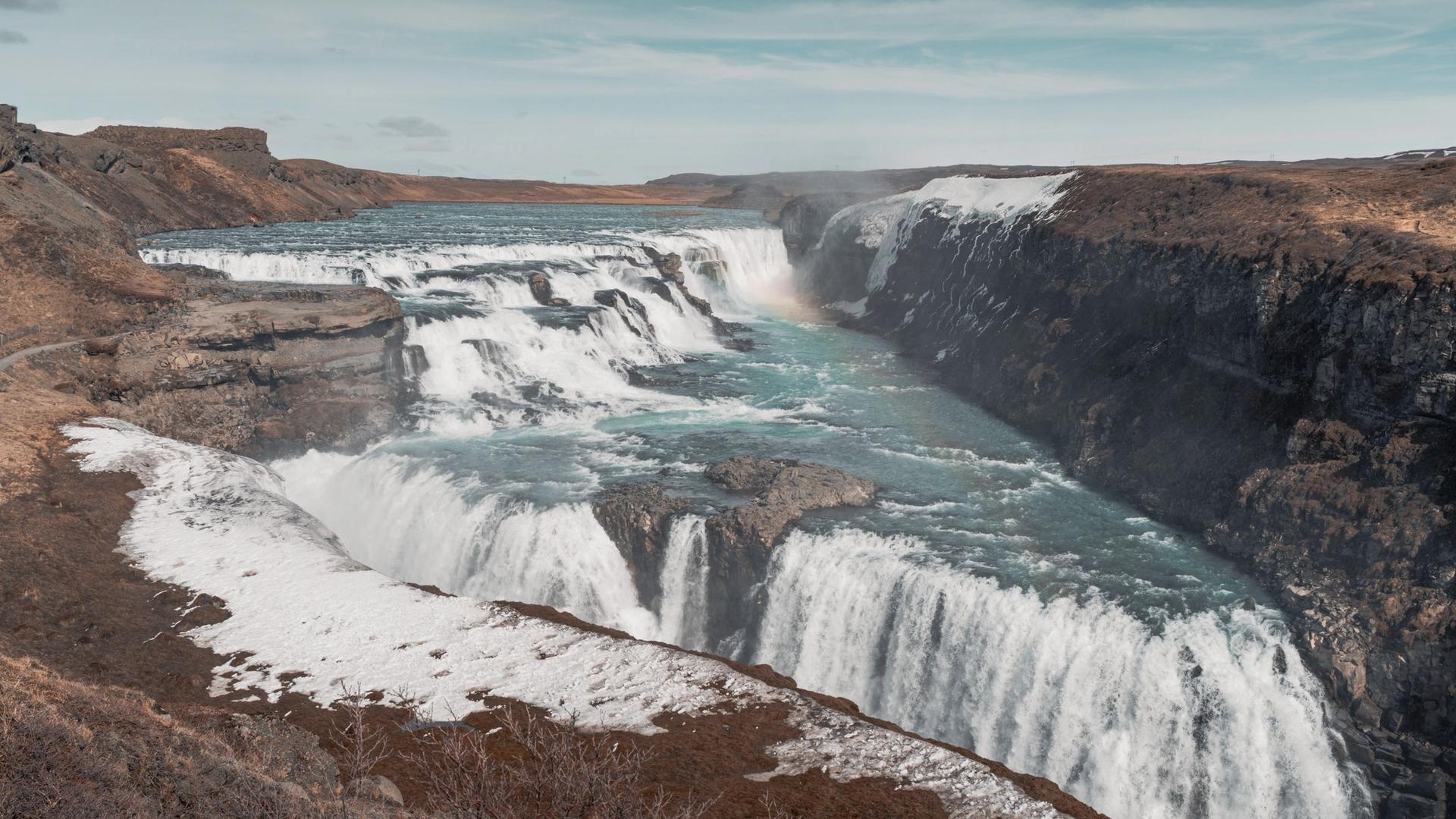 Two-tier Gullfoss waterfall dropping into a canyon