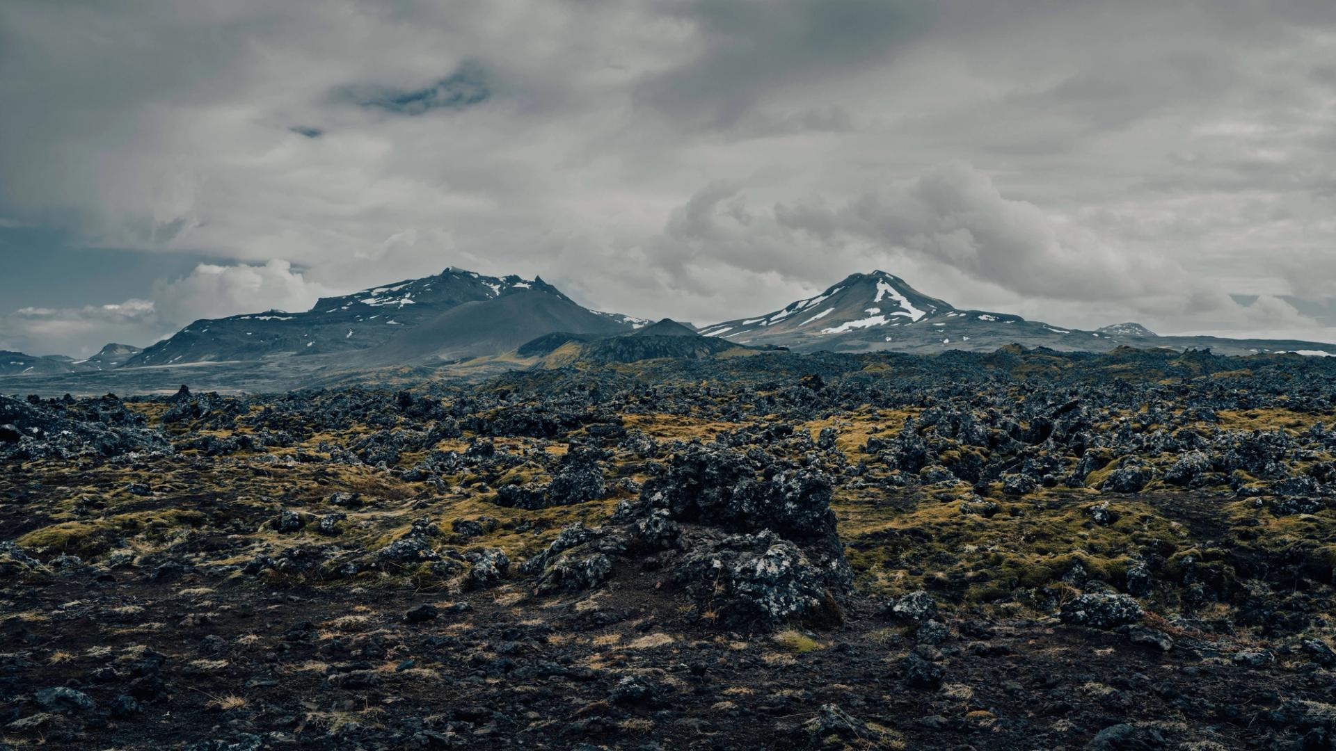 Snæfellsjökull glacier-capped volcano rising above a black lava field