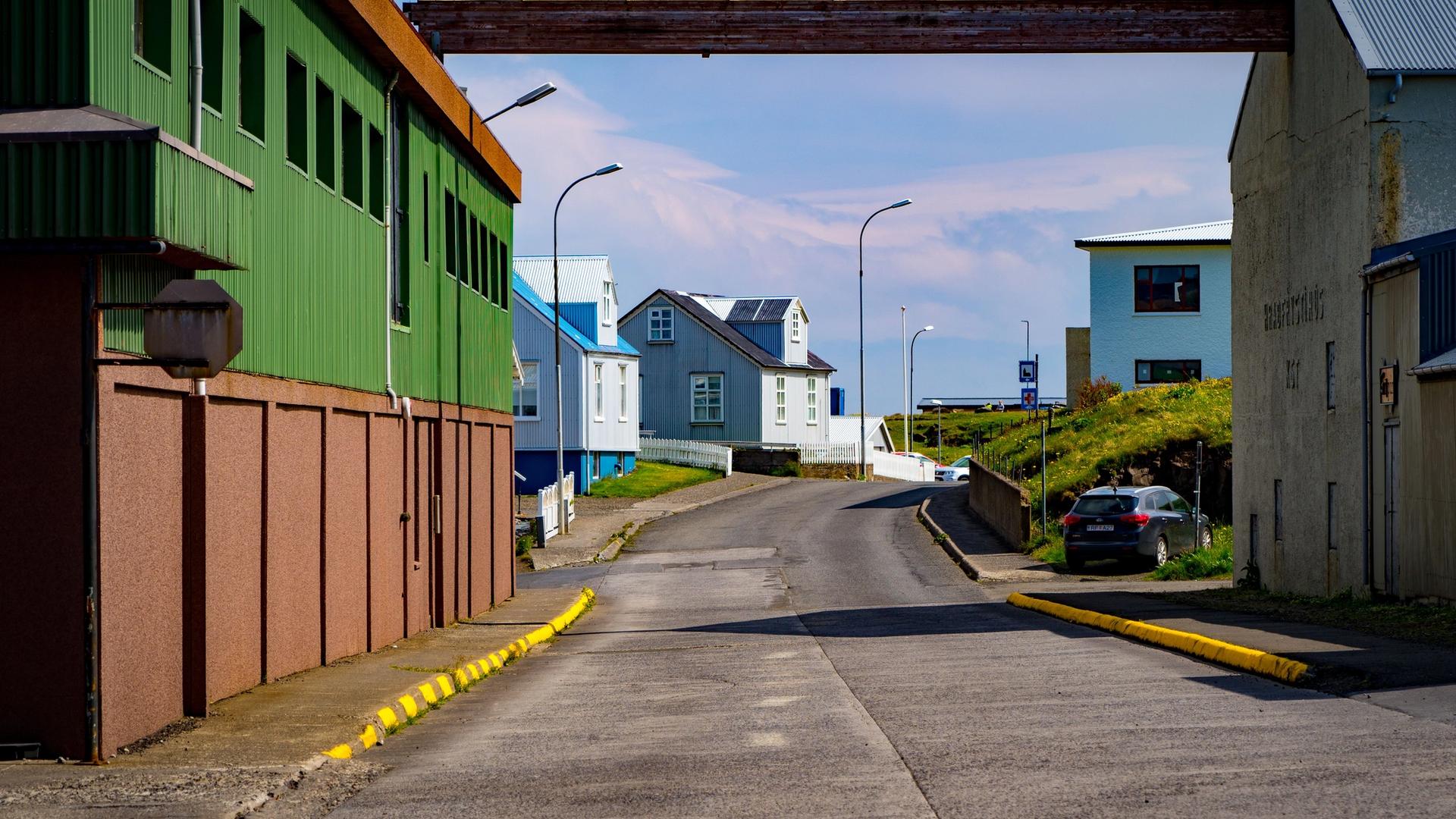 Colorful old harbour houses in Stykkishólmur with fishing boats