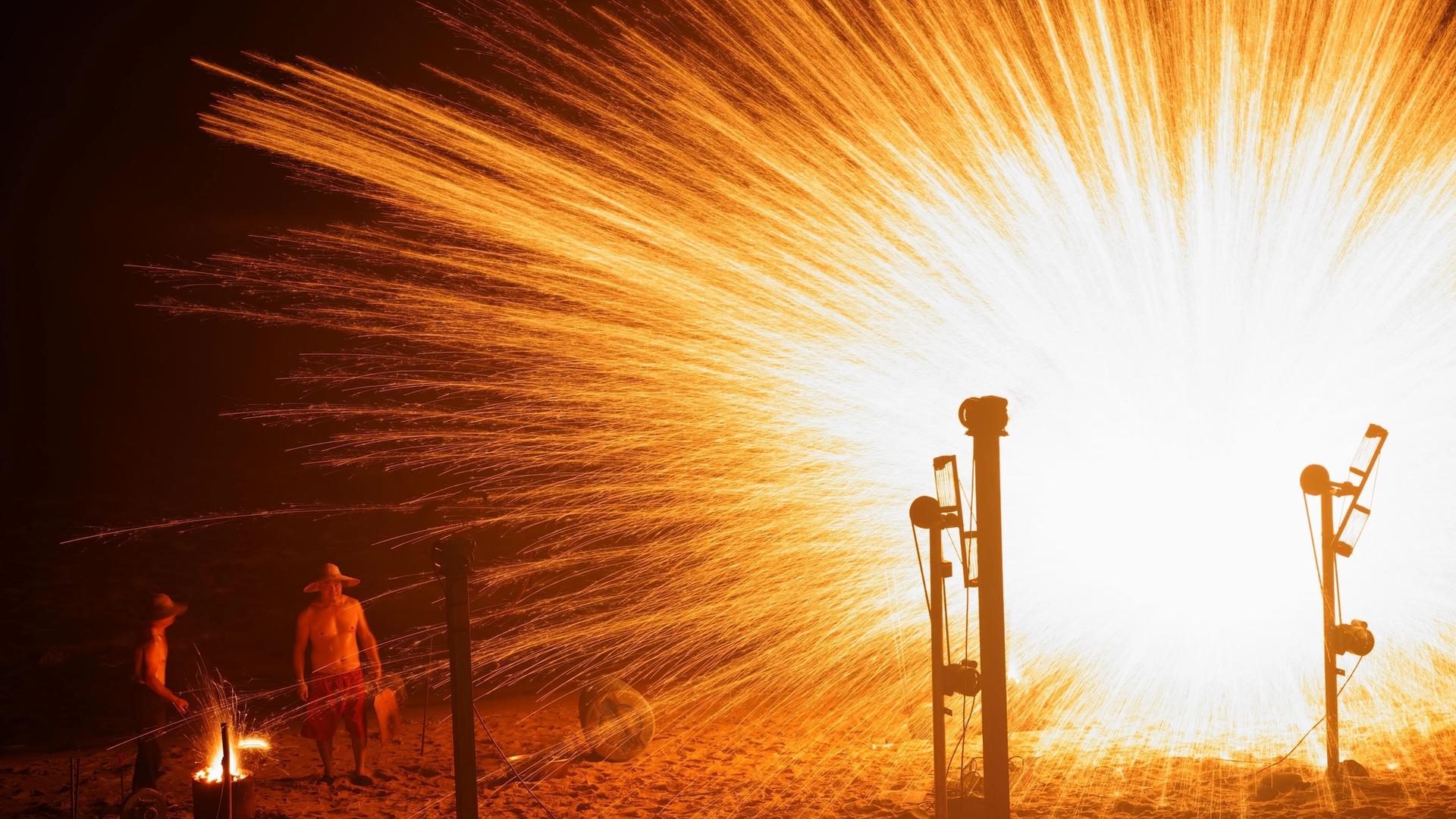 Bonfire and fireworks on a Catalan beach during the Sant Joan festival