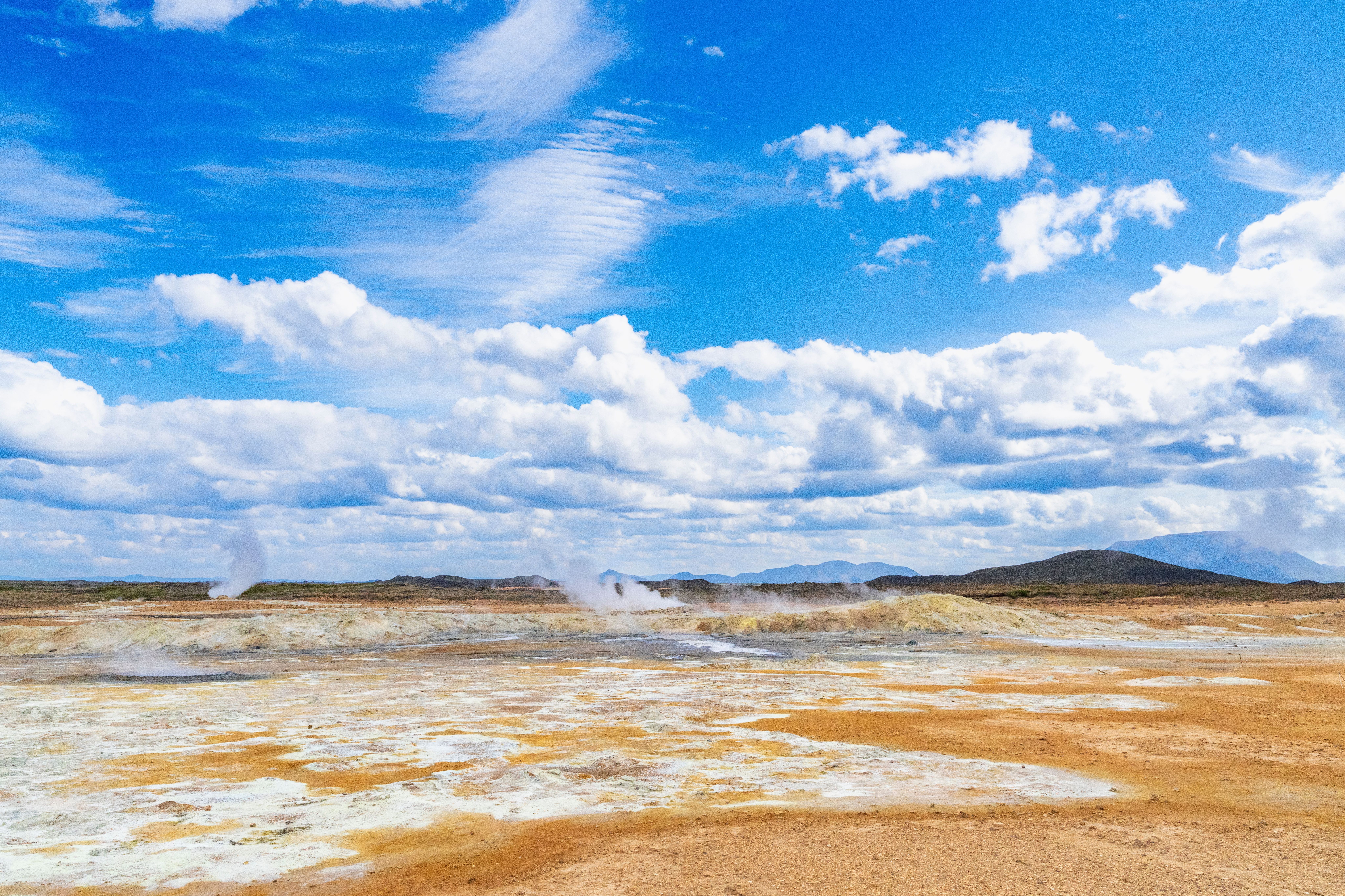 Steaming mud pots and orange sulphur ground at Hverir geothermal area