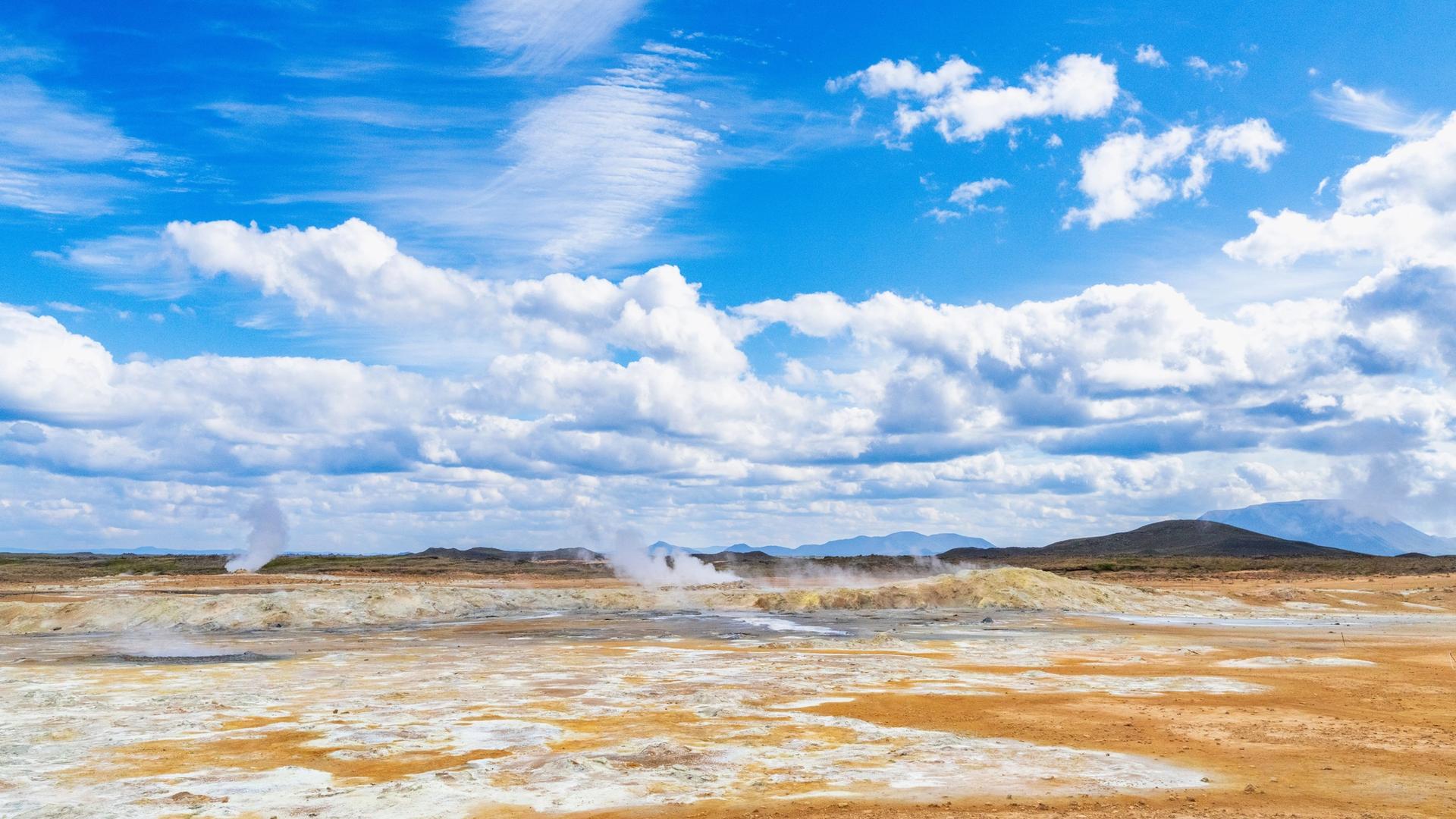 Steaming mud pots and orange sulphur ground at Hverir geothermal area