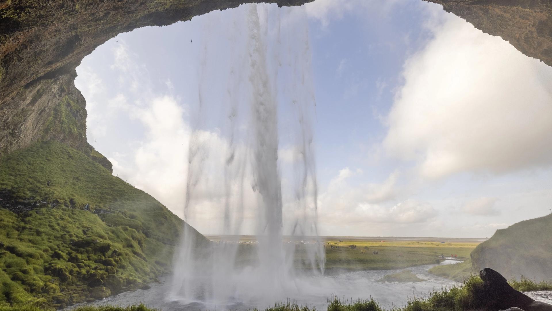 Seljalandsfoss waterfall with a path running behind the falling water
