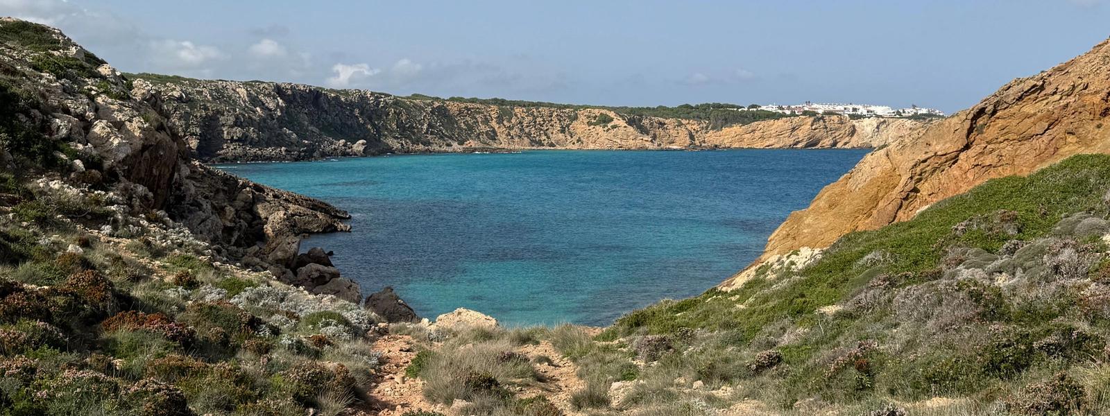 Menorca's coves: white sand in the south, red sand in the north