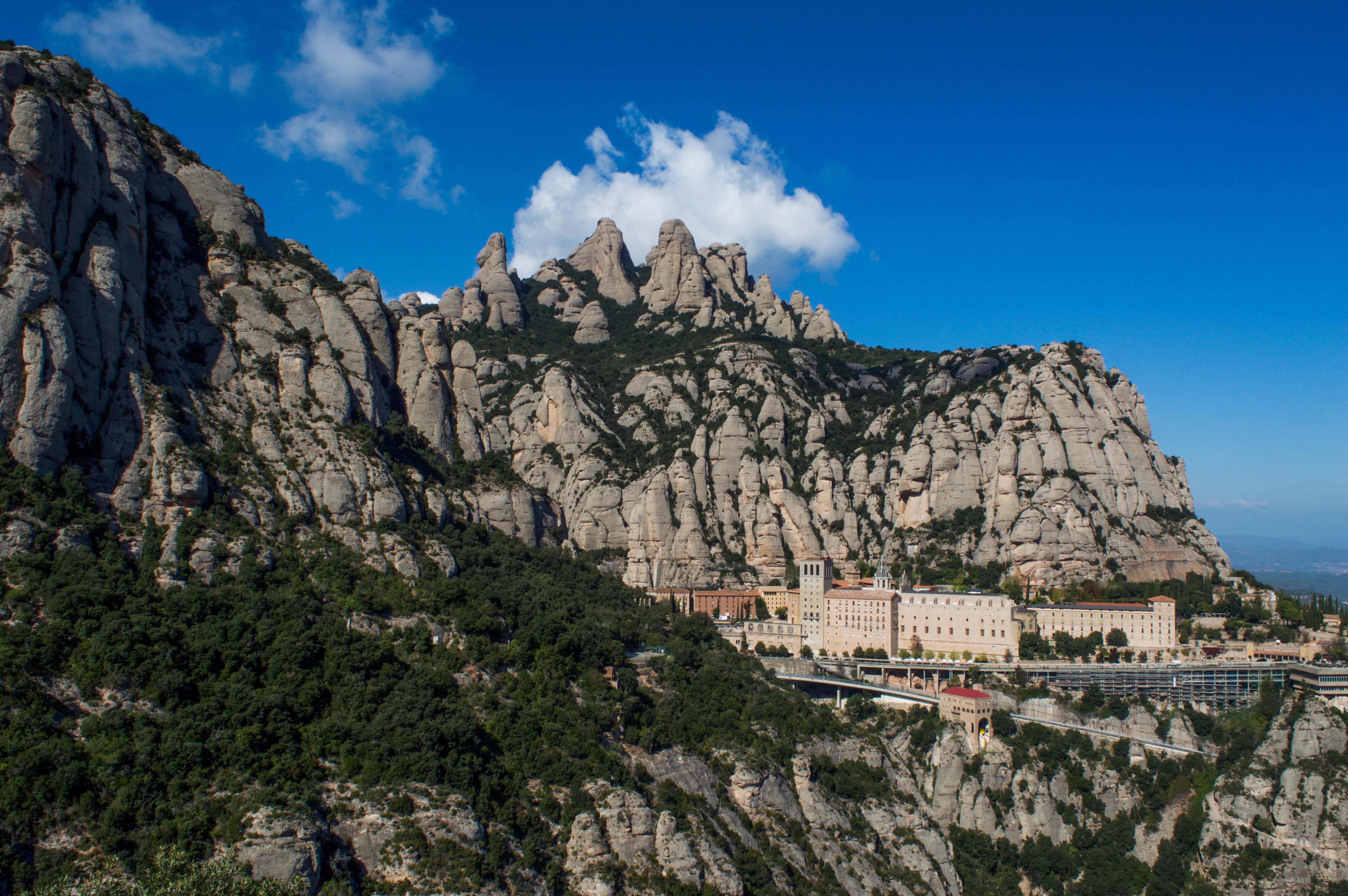 Montserrat's jagged conglomerate peaks rising above the monastery