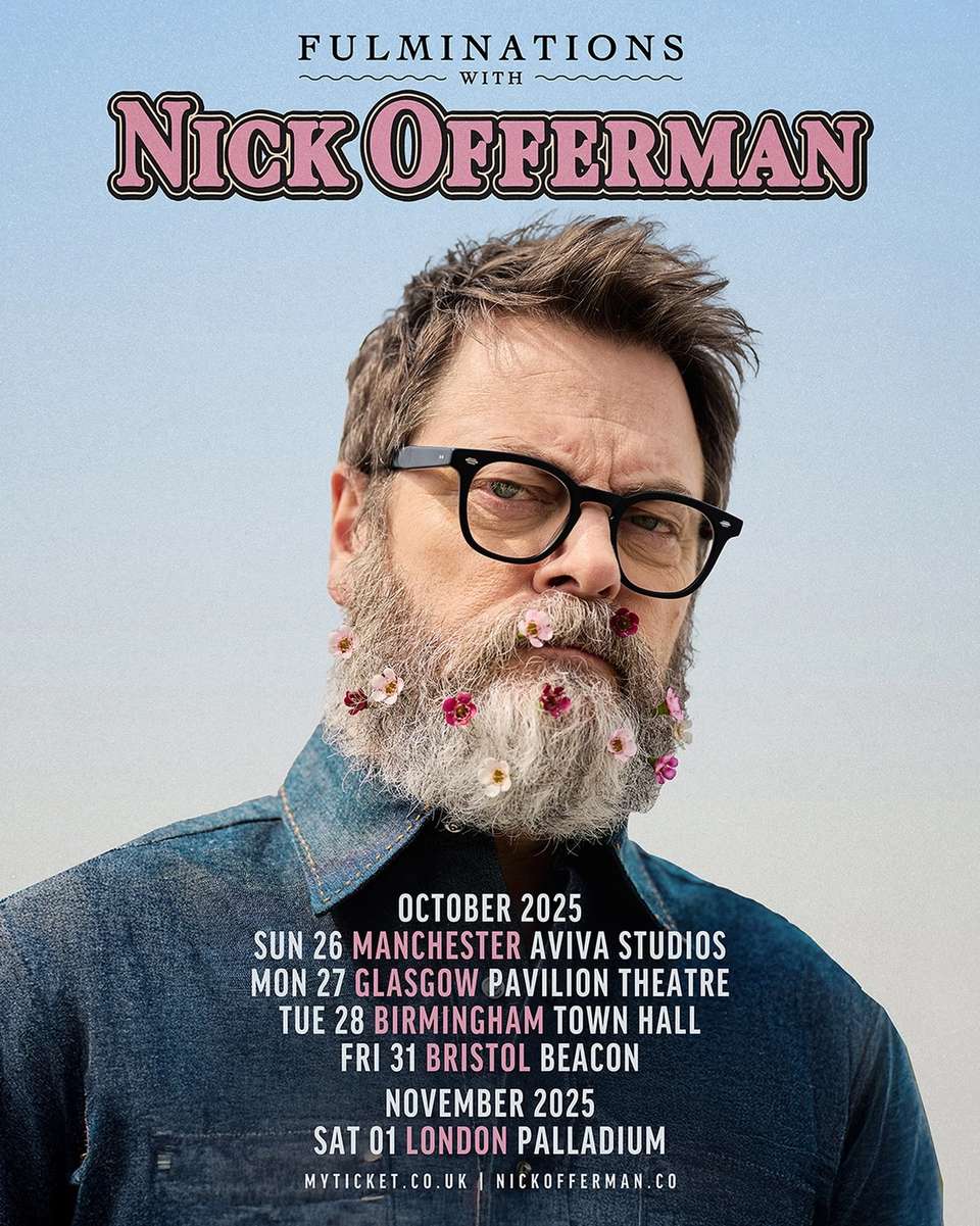 A portrait of Nick Offerman wearing glasses with heavy black frames. He has several small flowers tucked into his full beard. A dark blue flannel shirt is buttoned up to his neck. The collars of the shirt have bright yellow stitching. A list of tour dates overlays his torso.