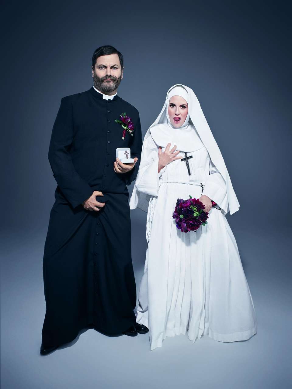 Nick & Megan dressed up as a catholic priest and nun respectively. Both clutching their private parts.