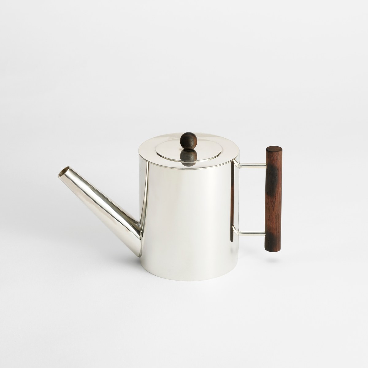 Handcrafted silver teapot with wooden details