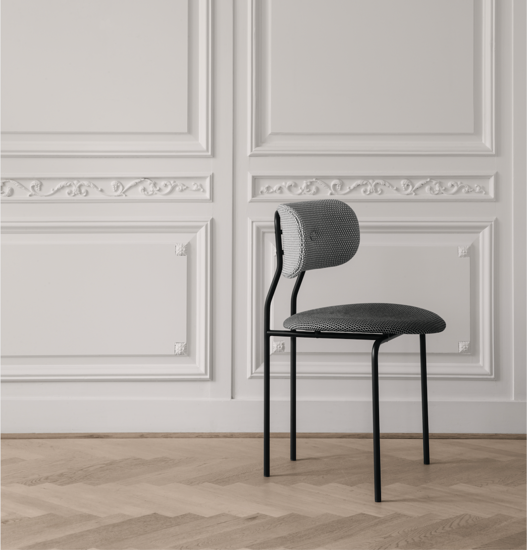 Upholstered chair with black metal frame