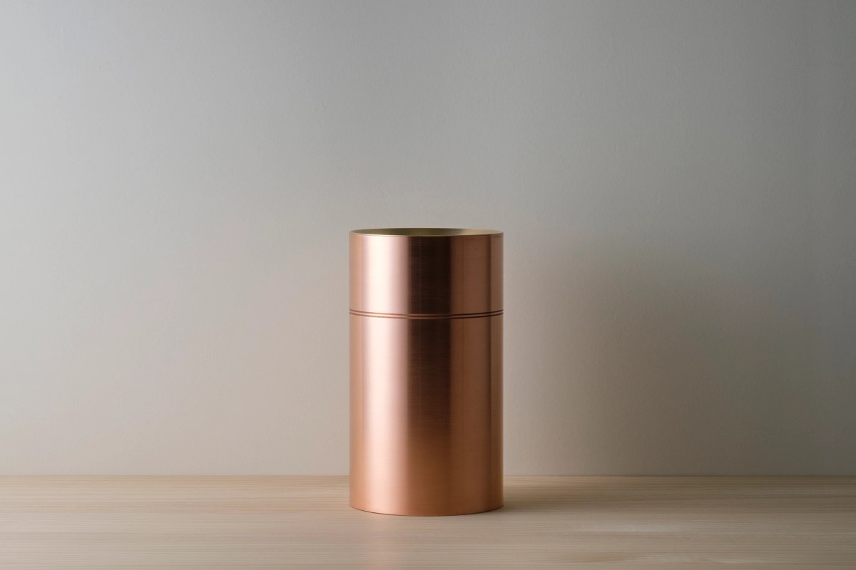 Vase in copper on wooden table