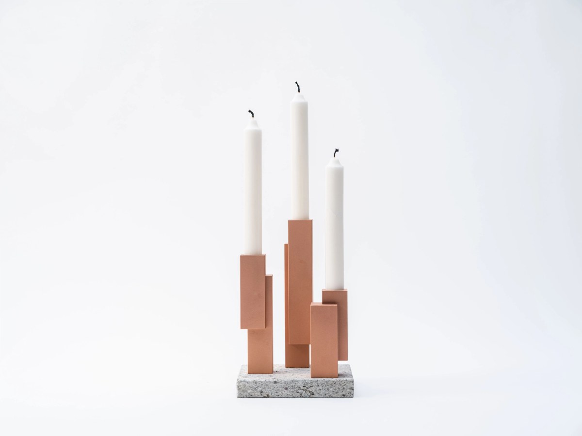 Brass candleholder on stone