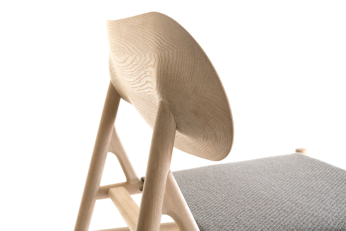 Wooden lounge chair with textile seat