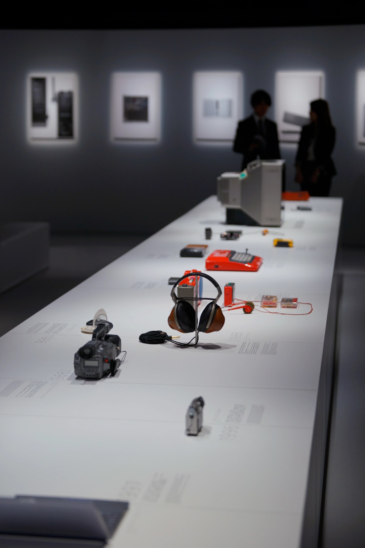 A long white display of historic Sony products