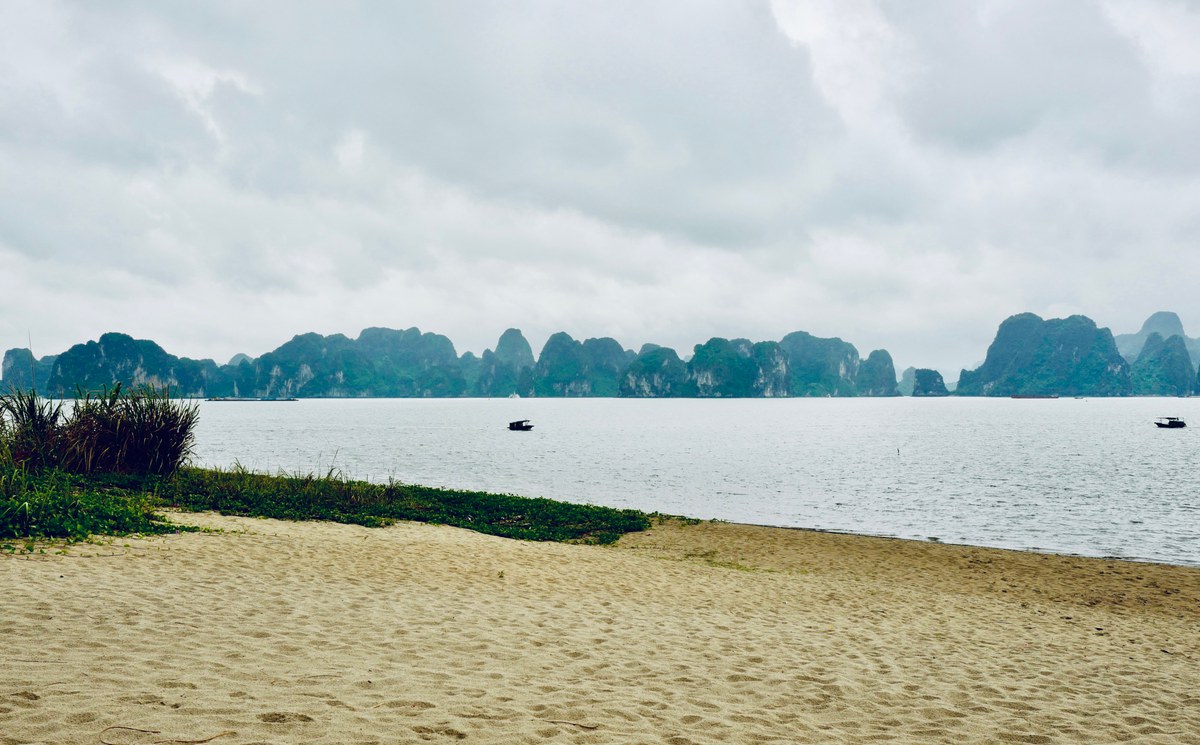 Beach front with a seascape of towering limestone karsts