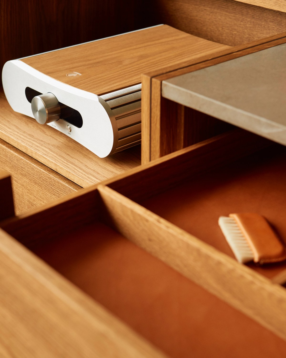 High fidelity equipment in wooden cabinet with leather details and objects 