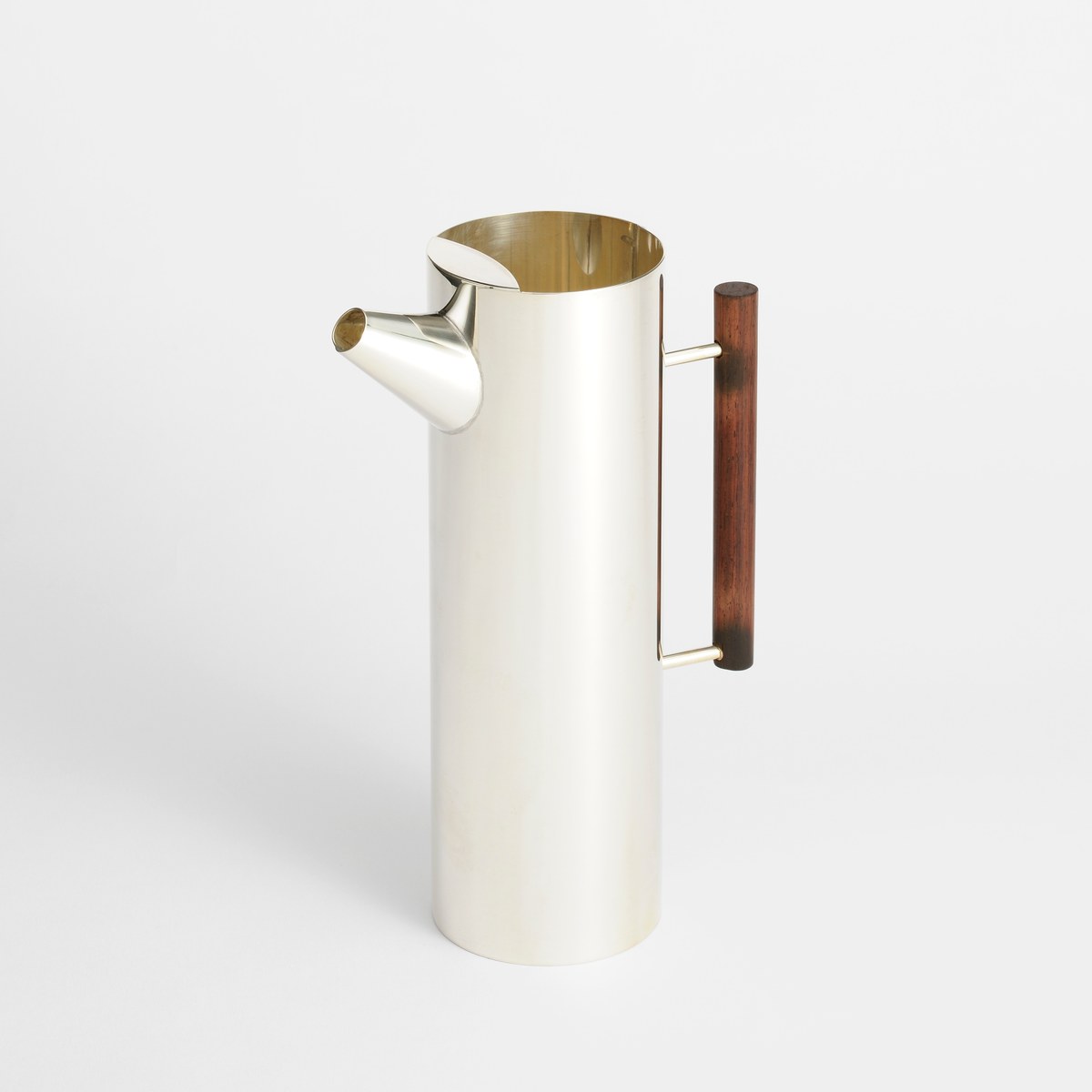 Handcrafted silver pitcher with wooden handle