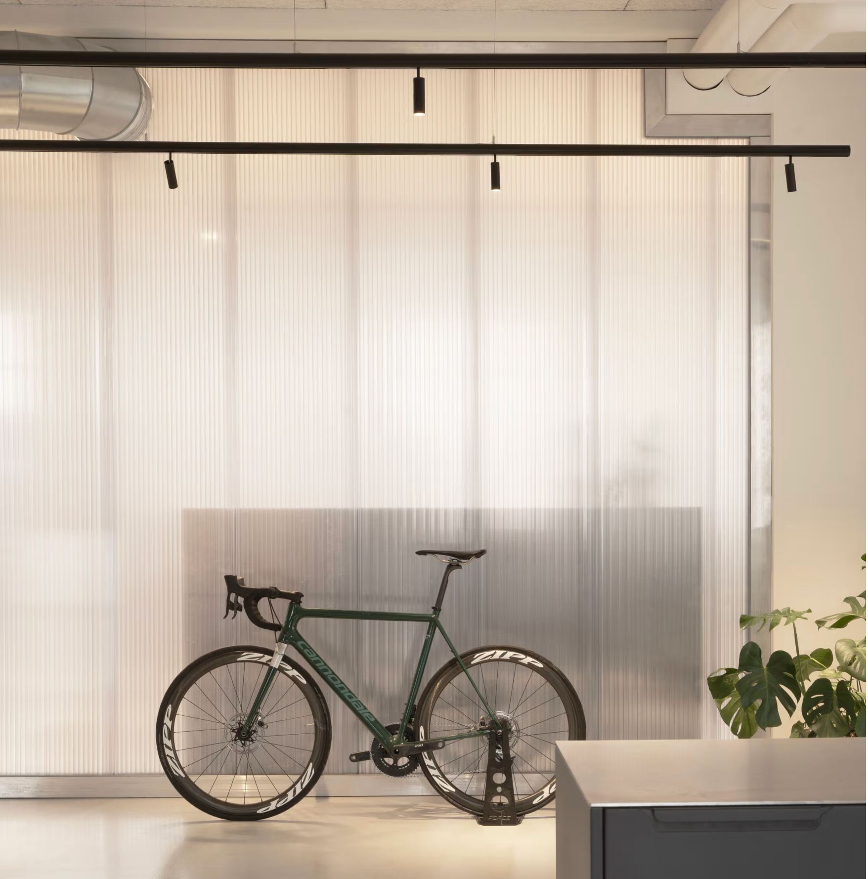 Racing bicycle in front of semi-transparent wall