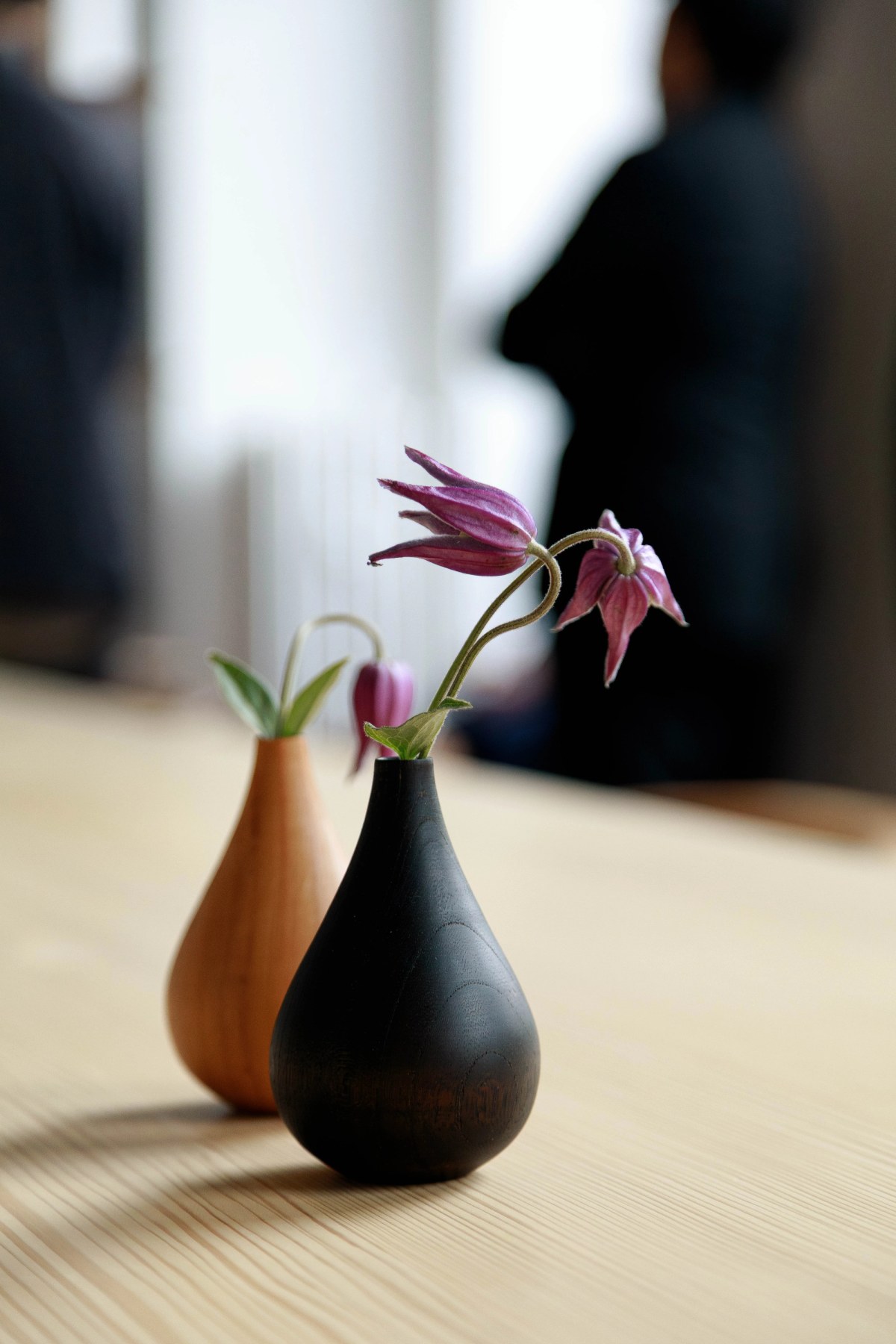 Two wooden vases on wooden table top