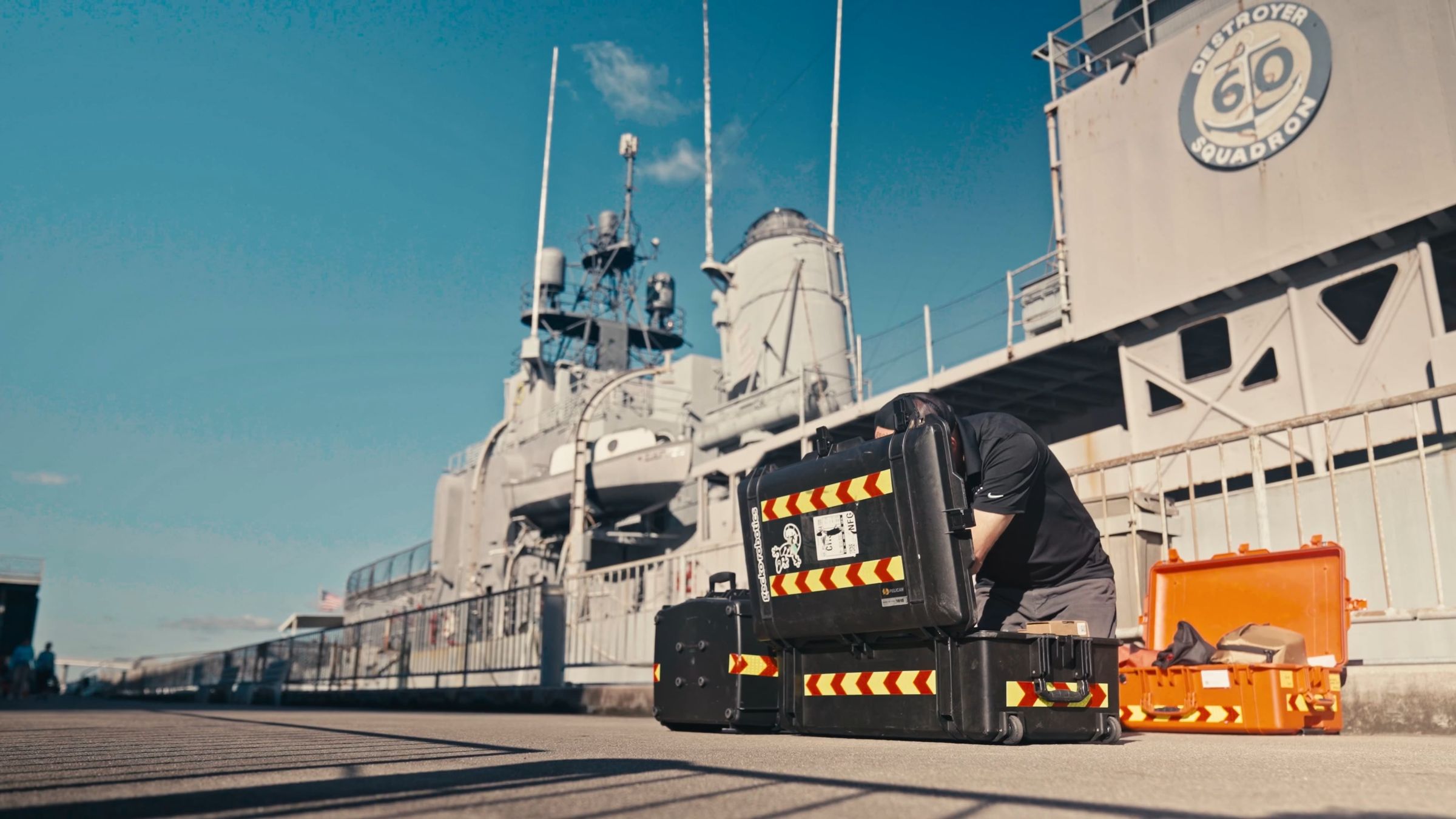 Gecko engineers with an inspection robot on the deck of a U.S. Navy ship