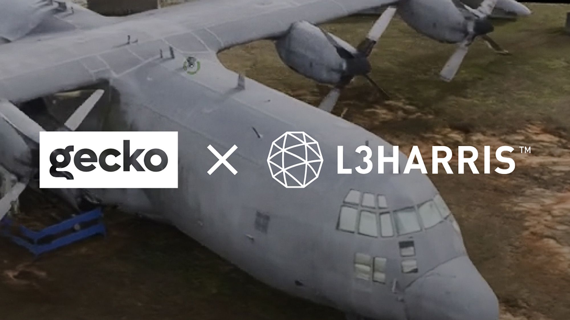 Gecko and L3Harris logos over a 3D scan of a military cargo plane