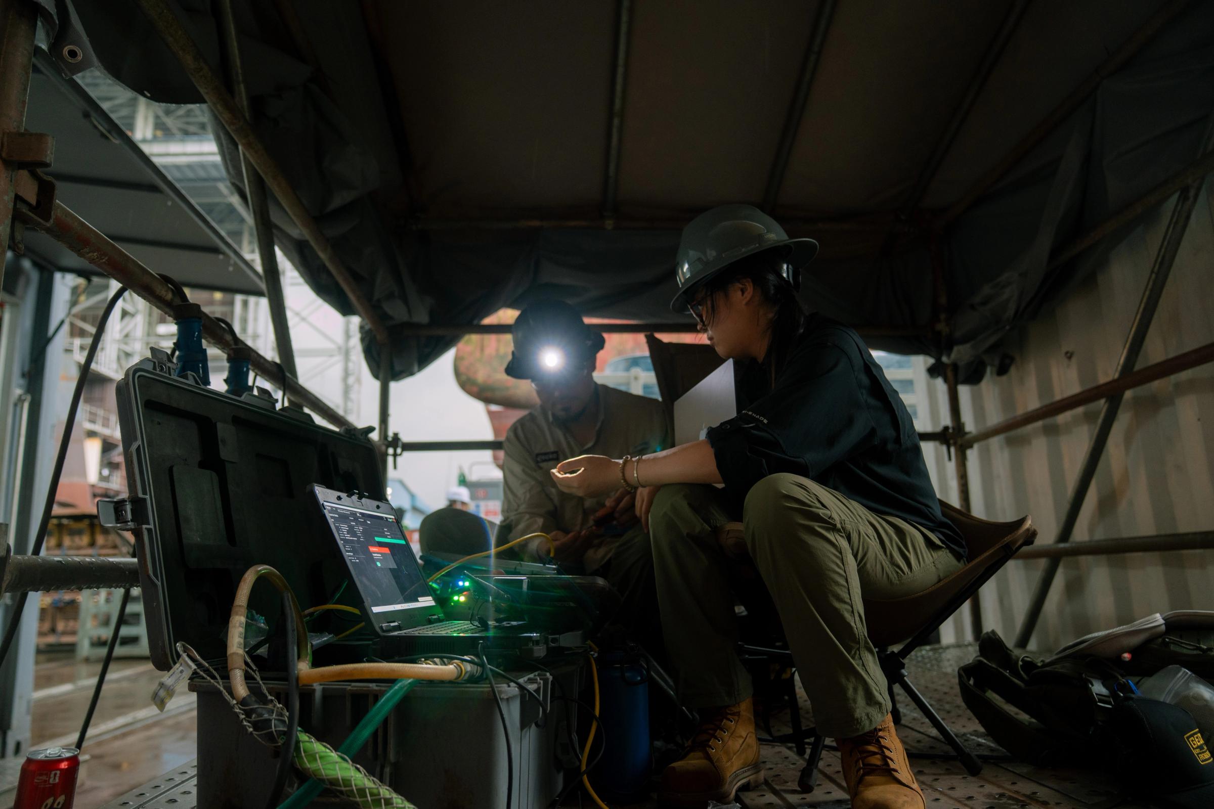 Forward deployed Engineers working in a shipyard