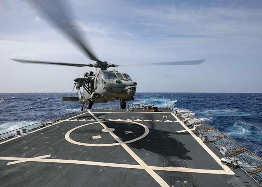 A helicopter landing on a flight deck