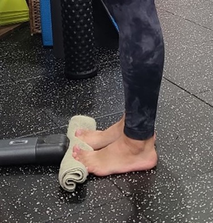 Calf raises on a rolled towel 1