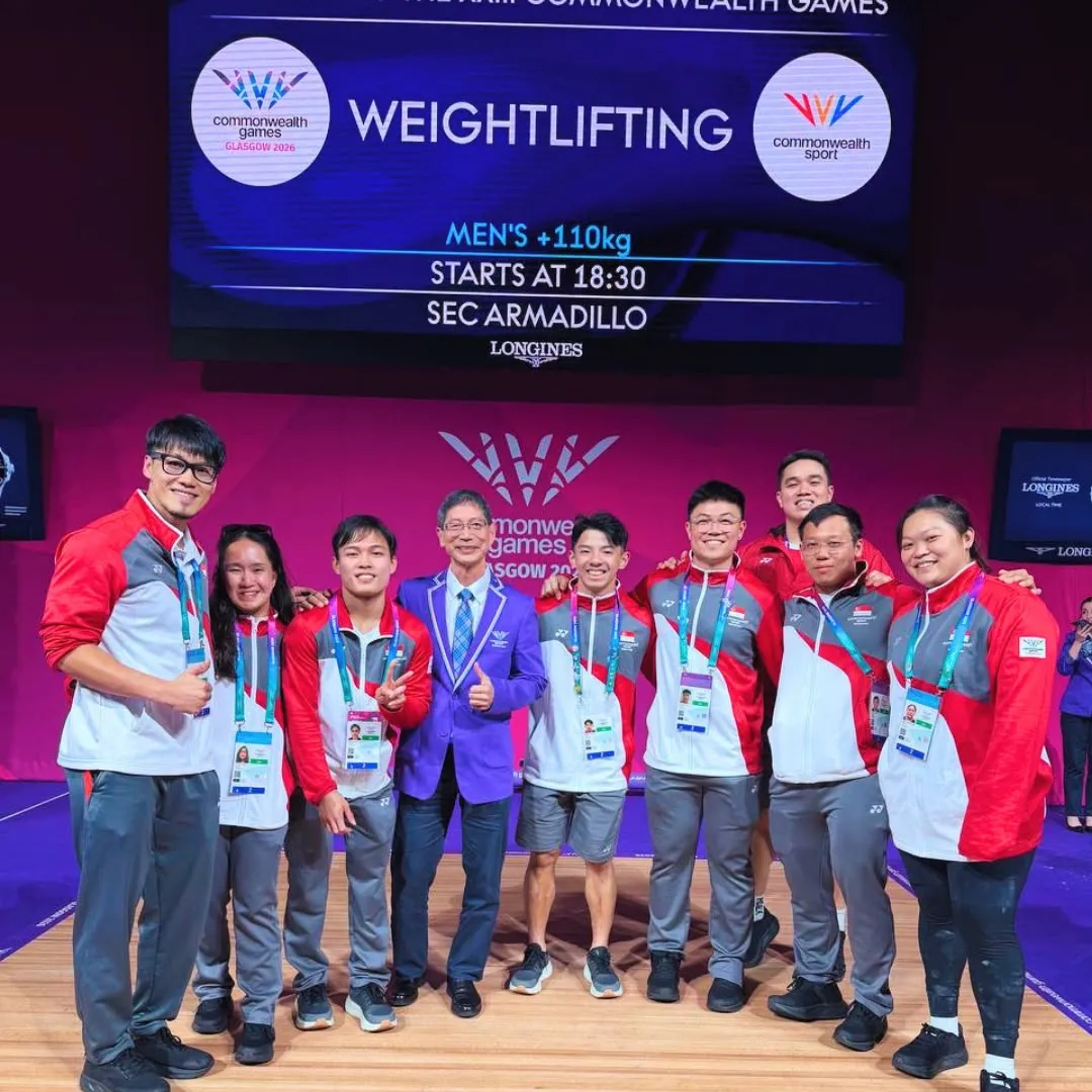 Activex physiotherapist TJ with Team Singapore's weightlifting squad and an official at the Glasgow 2026 Commonwealth Games.