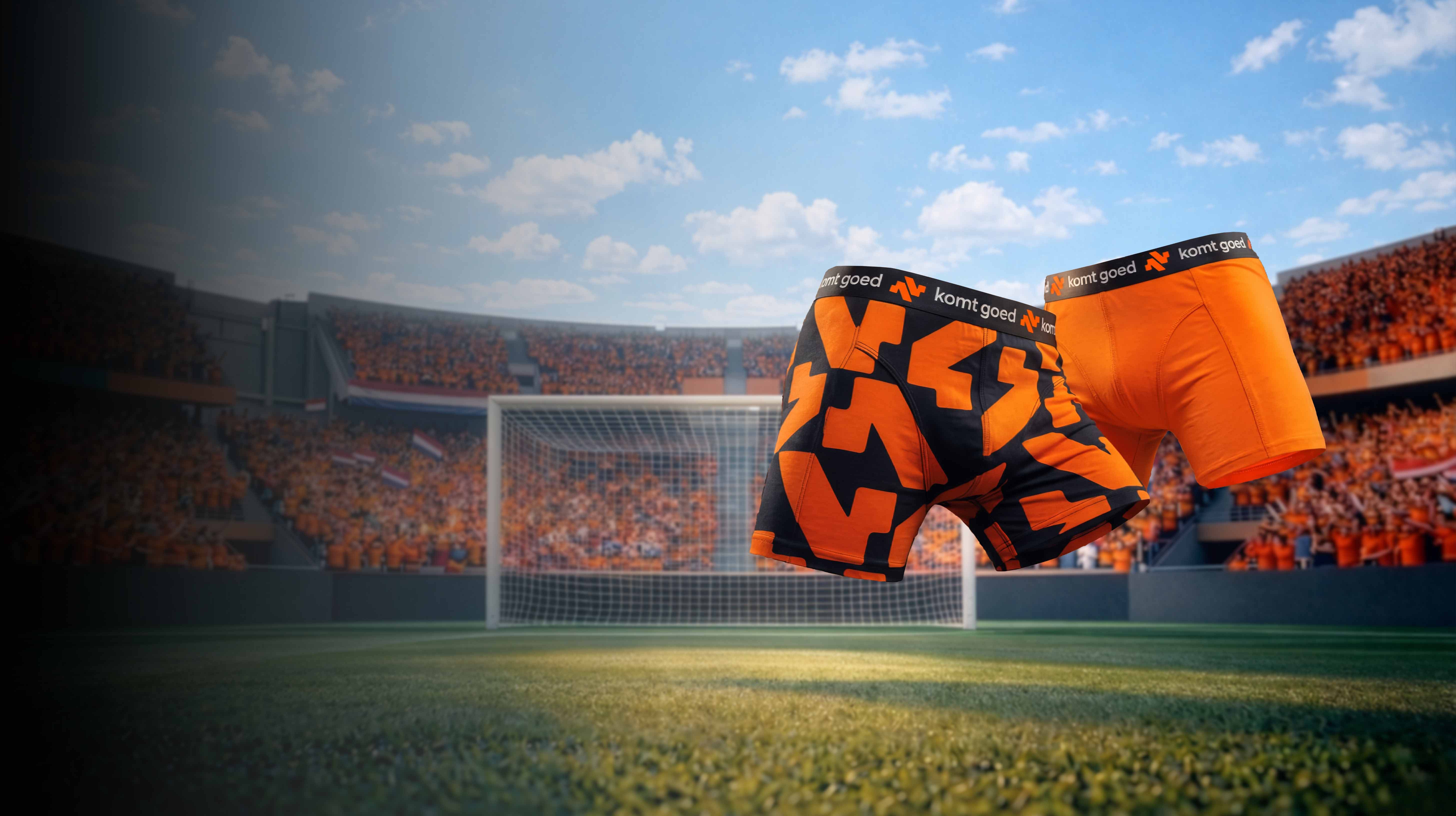 zwevende actie boxers boven een voetbalveld met Nederlandse supporters.