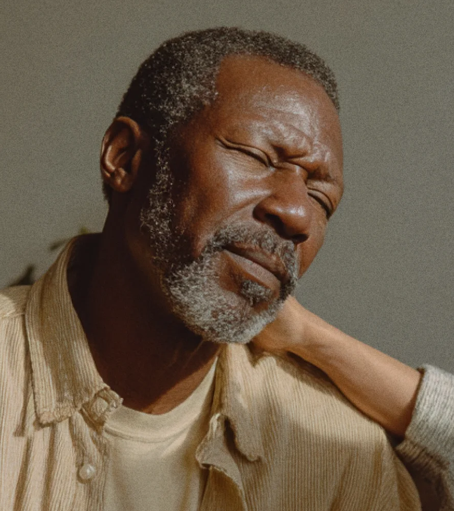 An older adult discussing fibromyalgia support with a care advocate