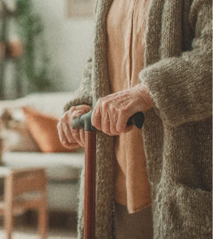 An older adult with mobility equipment