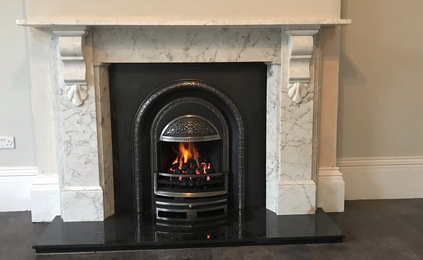 Fireplace - Marble Surround with insert and lit fire