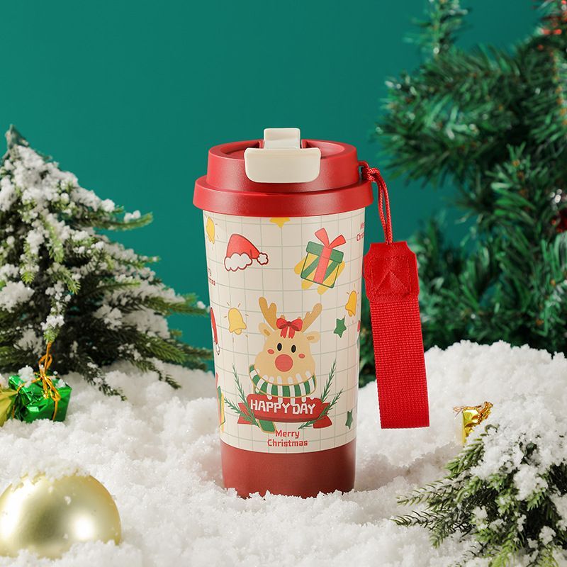 17oz Christmas coffee tumbler with red lid, wrist strap, and reindeer gift pattern