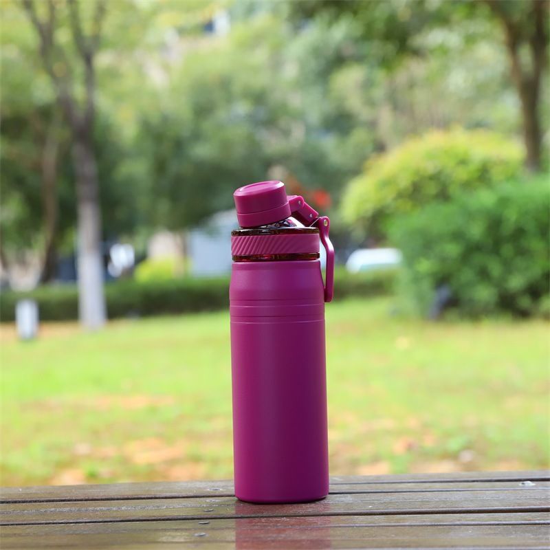 magenta insulated water bottle with flip spout