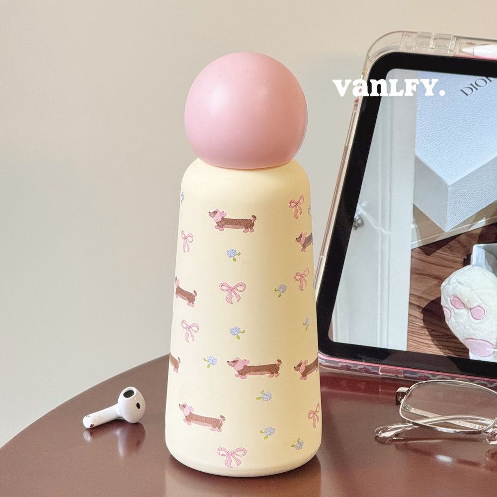 Cream 350ml stainless steel insulated bottle with pink round lid and cute UV printed dog and bow pattern