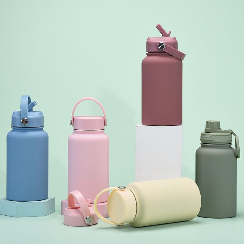 Outdoor stainless steel insulated water bottle with spout, straw and handle lids
